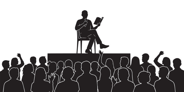 A silhouetted speaker passionately presents to a large audience captivating listeners with a book in hand on a stage