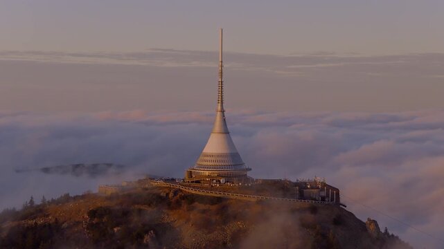 Beautiful Sunset over Famous Mountain Hotel Jested , Aerial Shot Above Clouds