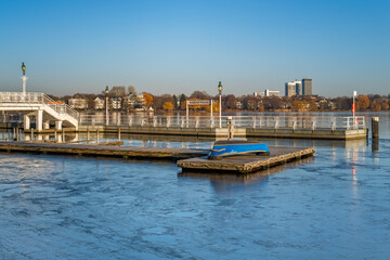 Fototapeta premium Hamburg, Germany. The frozen lake Alster in winter with pier.