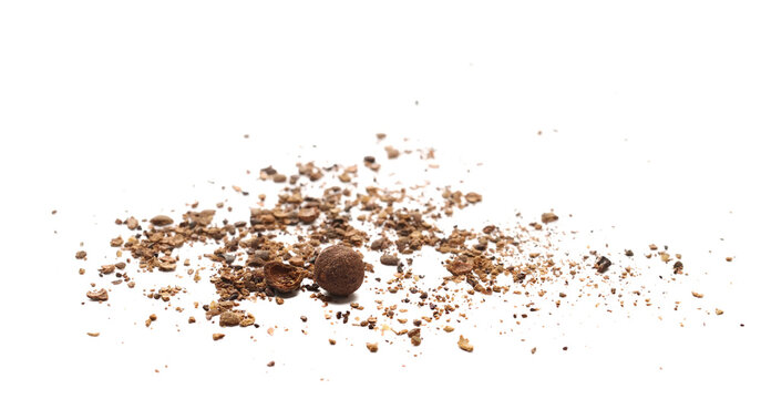 Allspice, pimento spice, Jamaican pepper, pile shavings isolated on white background, clipping path, side view