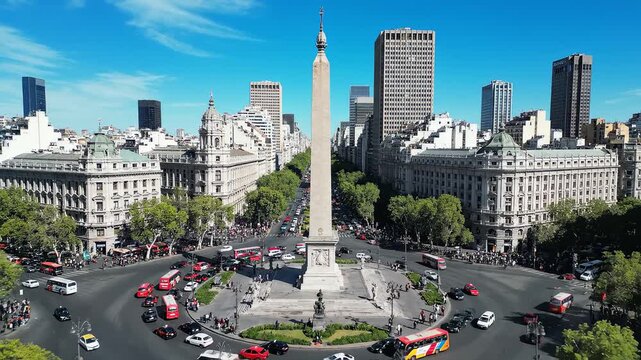City square with obelisk and traffic