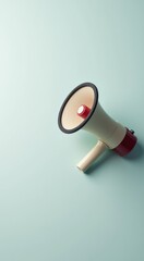 Red and white megaphone on a blue surface