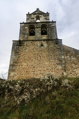 Obraz premium Bell tower of San Pelayo Church in Dehesa de Montejo with stone facade
