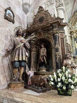 Statue of San Isidro Labrador with angel and oxen inside San Vicente Martir Church, Vega de Bur