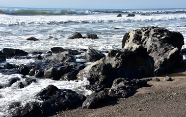 Large Asphalt Rocks on a Beach in California