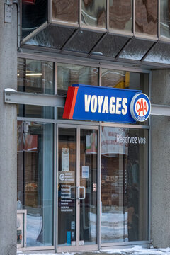 Canada, Montreal, 24 December 2025 : Travel agency entrance with CAA sign in snowy setting.