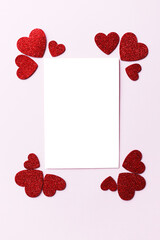 Valentines day card mockup. Empty greeting card flat lay with stylish pink and red glitter hearts on pink paper background. Happy Valentine's day postcard with space for text