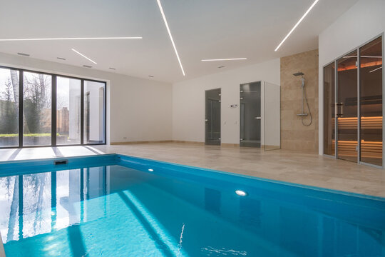 Indoor swimming pool in a private residence overlooking the courtyard. Nobody inside.