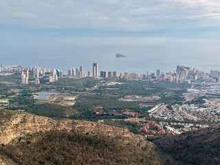 Luminous seaside panorama with sleek skyscrapers and inviting resorts emphasizing leisure and travel themes © Vladimir