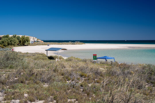 Stunning Coral Bay oceanfront white sandy beach turquoise waters pristine reef accessible from shore tropical Australian beach destination