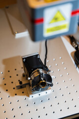 Jeweler professional laser engraving of gold ring.