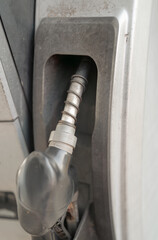 Close-up of electric vehicle charging connector plugged into charging port