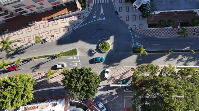 Aerial view of daily life around a road roundabout in Southern Europe, Malaga, Spain