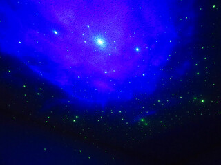 Fototapeta premium Blue Star Projection on Ceiling
