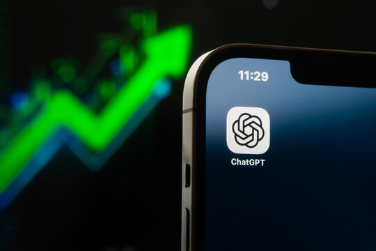 ChatGPT app logo on a smartphone screen in front of a rising green stock chart representing explosive growth and investment in artificial intelligence. Sonora, Mexico - January 27, 2026