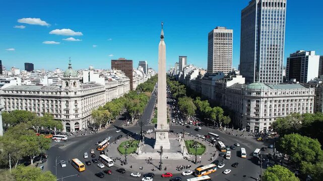 Cityscape with central obelisk and traffic