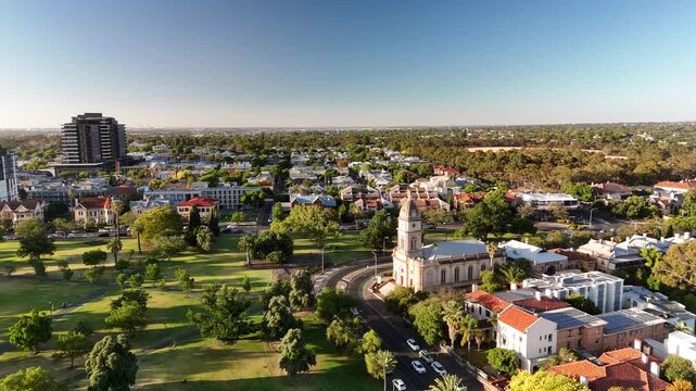 North Adelaide, South Australia: 4K Aerial Drone Footage of Brougham Place Uniting Church, CBD, Towers, Parklands, Suburban Houses, Residential Estates, City Landscape at Sunset