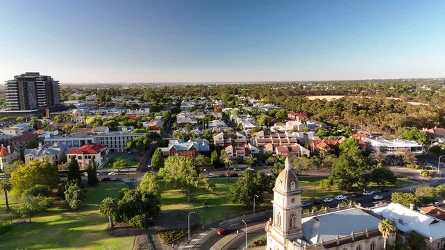 North Adelaide, South Australia: 4K Aerial Drone Footage of Brougham Place Uniting Church, CBD, Towers, Parklands, Suburban Houses, Residential Estates, City Landscape at Sunset