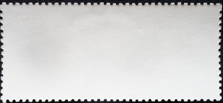 Empty back side of a vintage post stamp on black. Clean paper texture with perforated border. Rectangular design element for philately, letter, or greeting card layout. Photo