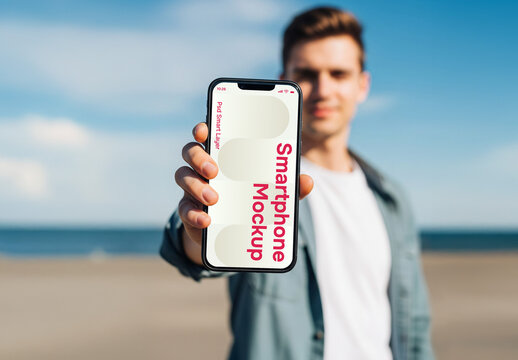 A man stretching his arm to show a smartphone - mockup