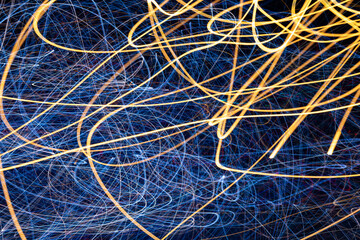 Abstract blue and golden light trails background