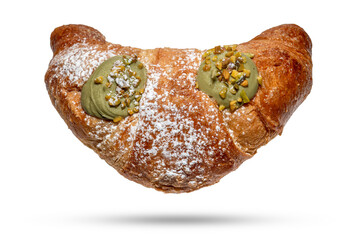 Croissant filled with pistachio cream isolated on white background with clipping path included
