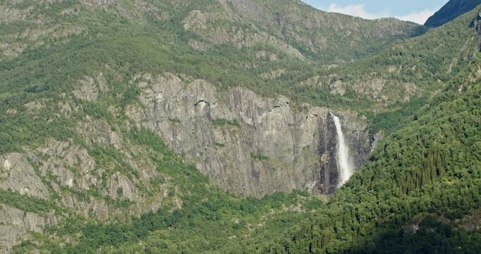 Langfoss waterfall cascading down a mountain in norway