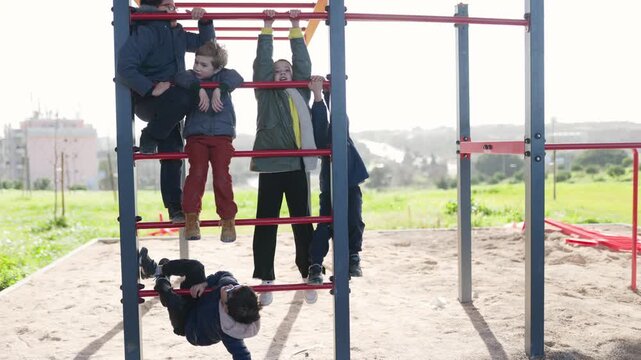 Active children playing together on playground monkey bars