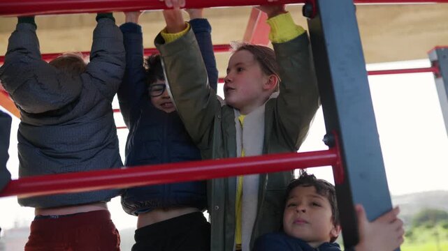 Children playing together on playground monkey bars