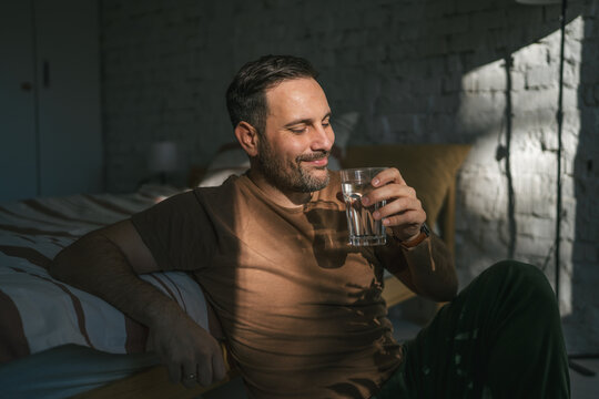 Man drinking fresh water for healthy morning routine hydration