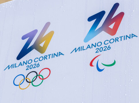 Cortina, Italy - January 27, 2026: Milano Cortina 2026 Olympic Games logo featuring Olympic rings and Paralympic emblem displayed on a white background with water droplets