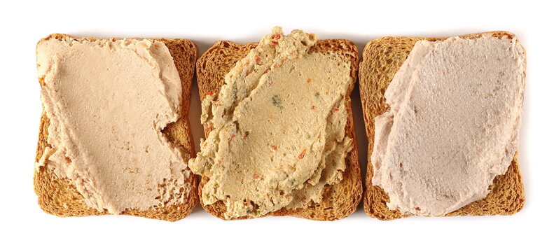 chicken, fish and liverwurst pate white whole wheat bread slice isolated on white, top view