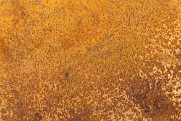 texture of a gold metal surface with rust. Old yellow rust iron steel weathered on constrcution side detail close up