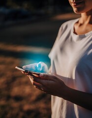 Person Holding a Smartphone with Glowing Unread Message Notification Creating a Suspenseful Digital Communication Concept