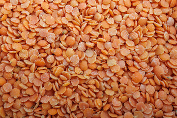 Fototapeta premium Close up background of red lentils for healthy eating, plant based protein and nutrition concept