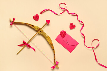 Naklejka premium Composition with cupid's bow, envelope and hearts on color background. Valentine's Day celebration