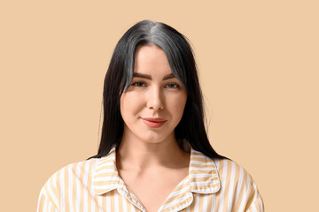 Obraz premium Young woman with graying hair on beige background