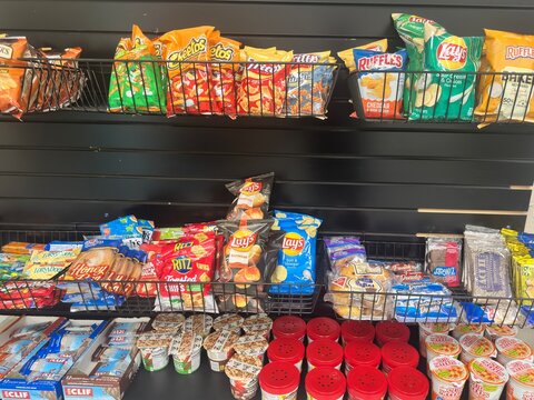 Modern Vending Options. Micro market vending kiosk with individually packaged snacks for purchase. 