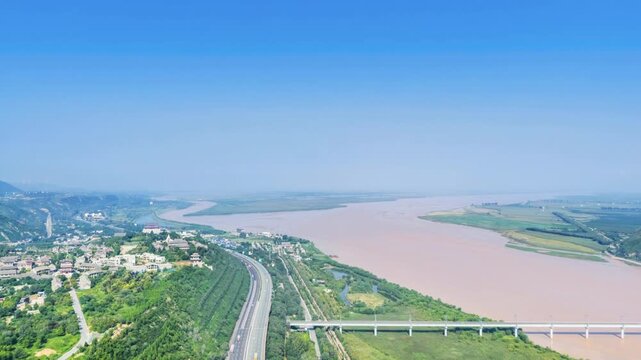 Aerial time-lapse of Tongguan Ancient City and the Yellow River, historic fortifications landmarks, dramatic loess terrain, and the confluence of Wei and Yellow Rivers in Shaanxi Province, China
