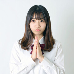 お願いポーズの女子高生