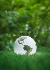 Sustainability globe with environmental icons in green park. 3d rendering