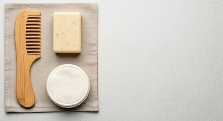 Eco-Friendly Hair Care Essentials: A Bamboo Comb, Natural Soap Bar, and Cotton Pad Arranged on a Soft Cloth for a Sustainable Beauty Routine.Zero waste concept.copy space,