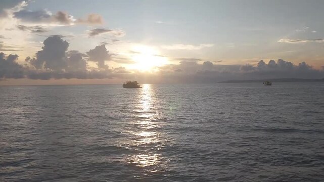 ships sailing in the afternoon at a beautiful sunset