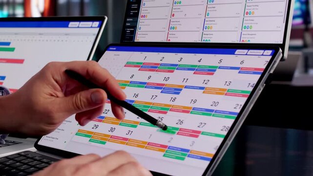Man Using Calendar Software