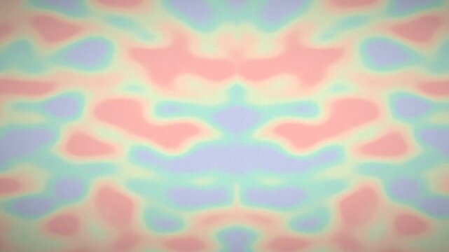 Soft pastel abstract symmetrical pattern with blurred colors creating a calming and organic visual effect.