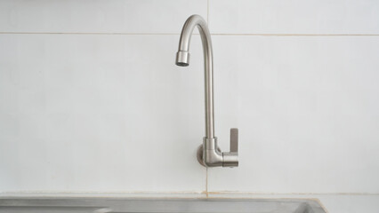 Modern Kitchen Faucet on Tiled Wall
