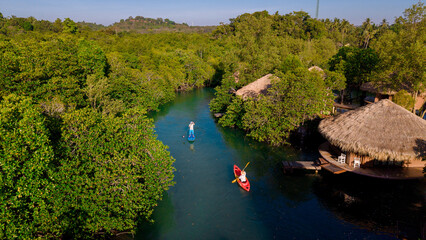 Explore the serene waterways of Koh Phayam Island, Thailand with stunning natural landscapes