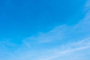 A bright, clear blue sky meets a glowing white horizon, suggesting a serene, open, and with sunlight of beautiful cloudy sky. landscape or abstract background	
