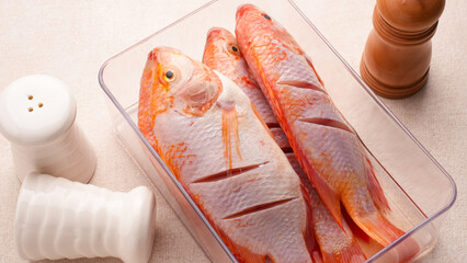 Ikan Nila Merah, raw red tilapia fish, food preparation