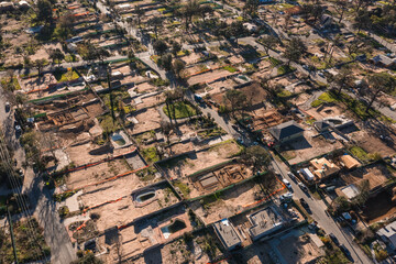 Drone view of empty lots of homes left behind from the Eaton fire, Pacific Palisades. January 2025, a series of 14 destructive wildfires affected the Los Angeles County in California, United States. © ShutterFalcon
